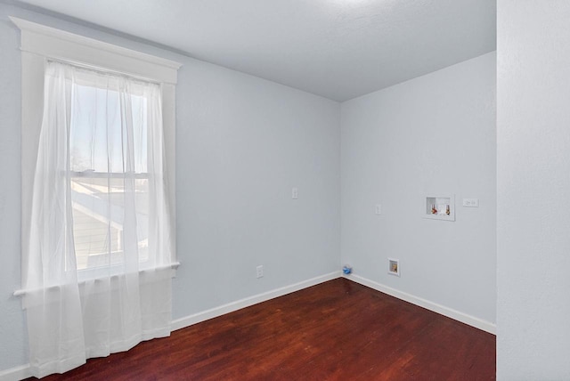 spare room featuring dark hardwood / wood-style floors