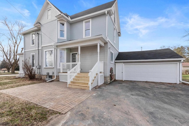 view of front of property featuring a garage and covered porch