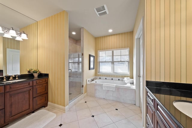 bathroom with vanity, tile patterned floors, and independent shower and bath