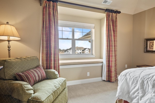 carpeted bedroom with lofted ceiling