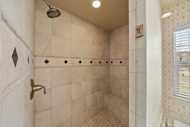 bathroom with a tile shower