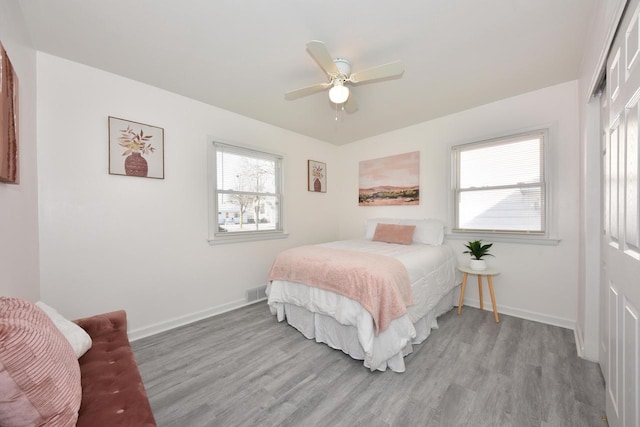 bedroom featuring ceiling fan and light wood-type flooring