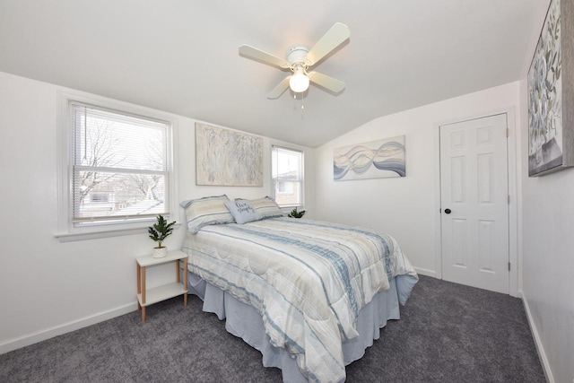 carpeted bedroom with multiple windows, lofted ceiling, and ceiling fan