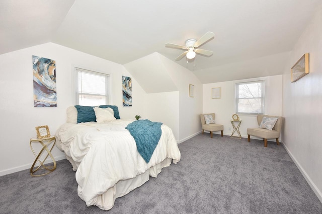 carpeted bedroom featuring multiple windows, lofted ceiling, and ceiling fan