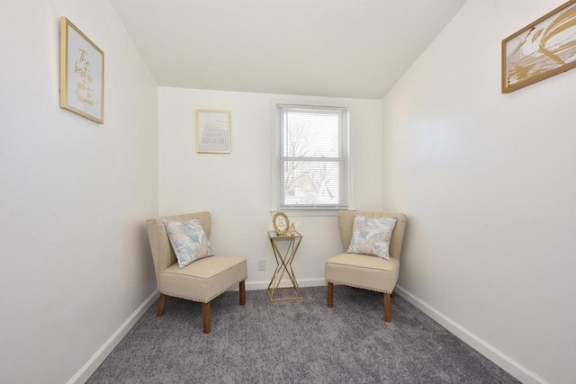 living area with lofted ceiling and carpet flooring