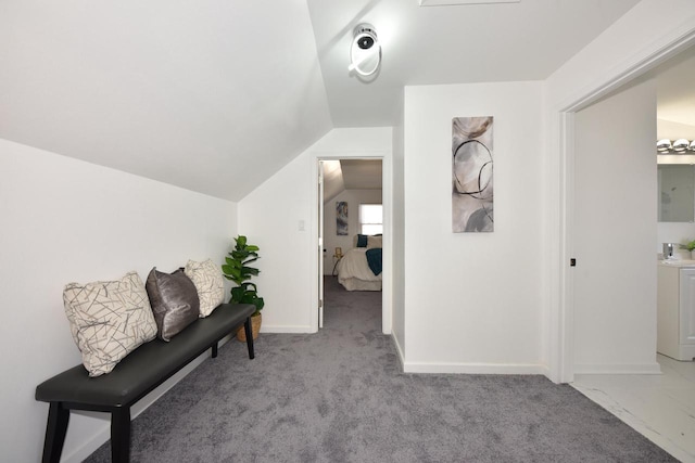 sitting room with light colored carpet and lofted ceiling