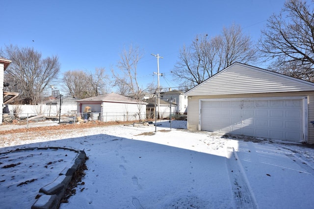 exterior space with an outbuilding and a garage