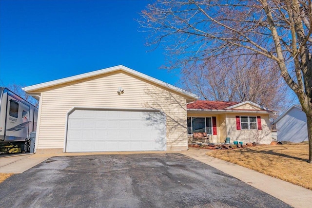 ranch-style home featuring a garage