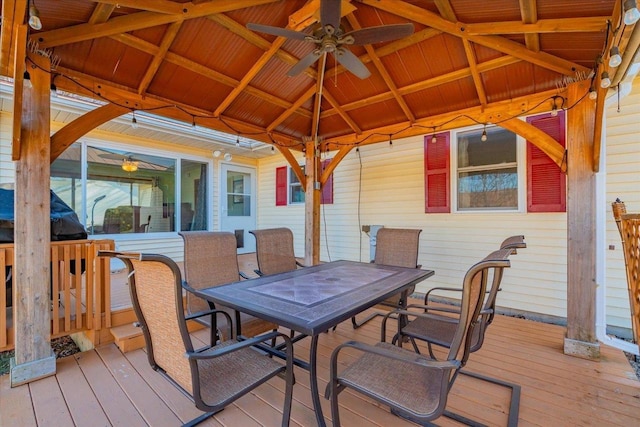 wooden deck featuring a gazebo and ceiling fan