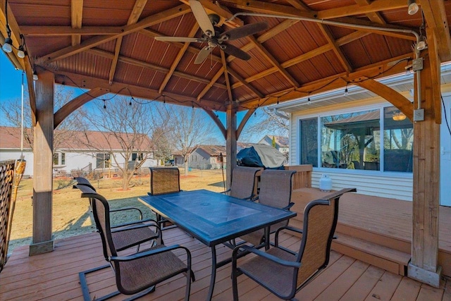 wooden deck featuring a gazebo and ceiling fan