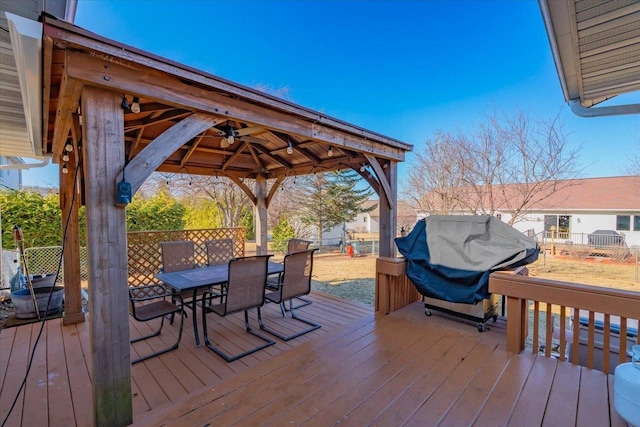 deck featuring a gazebo, grilling area, and ceiling fan