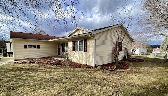 view of home's exterior featuring a yard