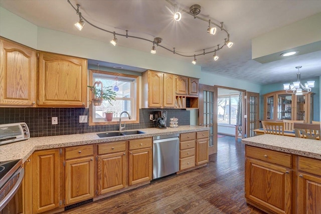 kitchen featuring pendant lighting, sink, a wealth of natural light, and stainless steel appliances