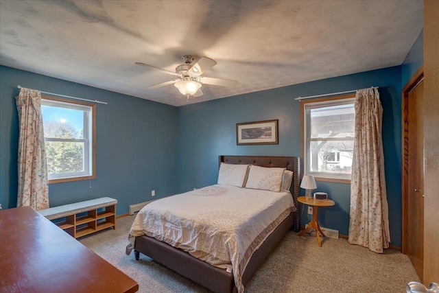 bedroom featuring ceiling fan and light colored carpet