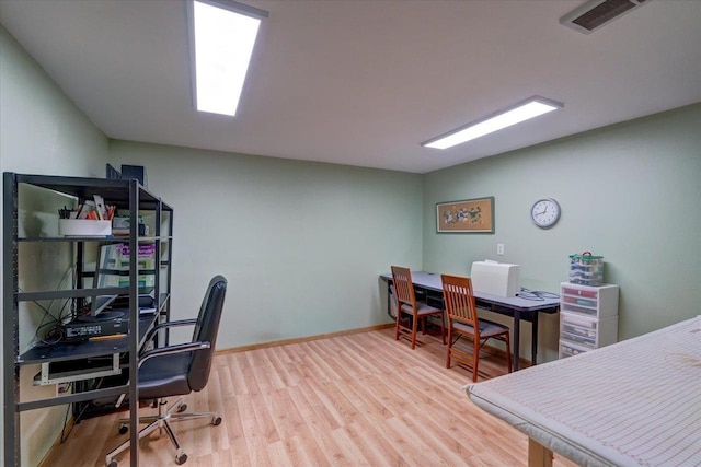 home office featuring light hardwood / wood-style floors