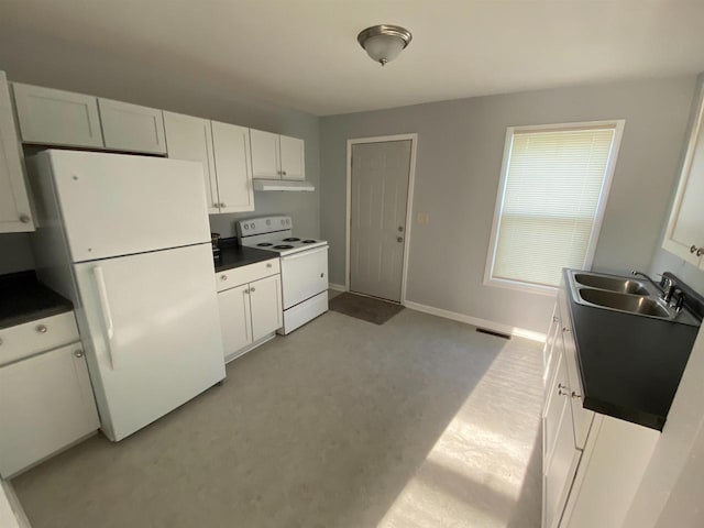 kitchen with white appliances, sink, and white cabinets