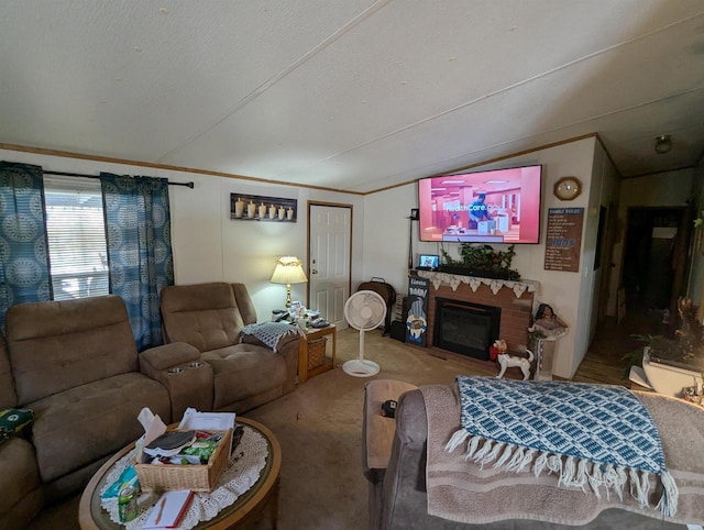 living room featuring carpet floors, a fireplace, and a textured ceiling