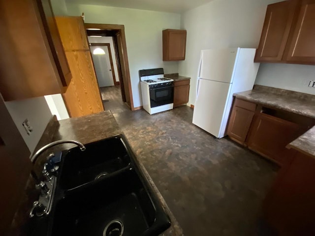 kitchen with sink and white appliances