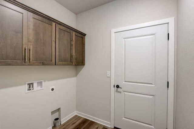 washroom with dark hardwood / wood-style floors, cabinets, hookup for an electric dryer, and hookup for a washing machine