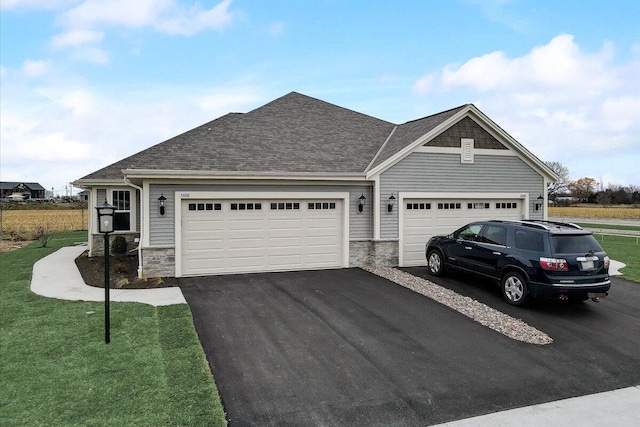 view of front facade featuring a garage and a front lawn