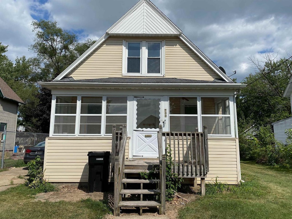 back of house with a yard