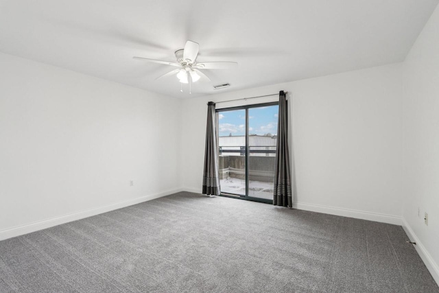 carpeted spare room featuring ceiling fan