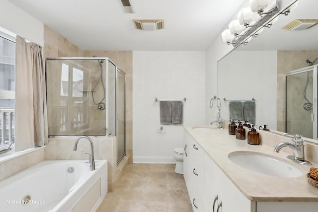 full bathroom with independent shower and bath, vanity, an inviting chandelier, and toilet