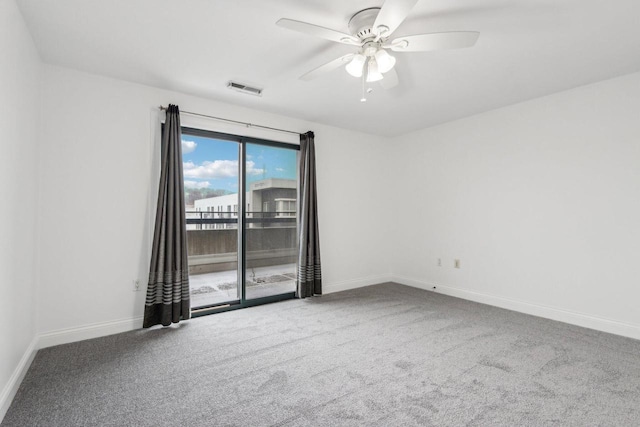 carpeted empty room featuring ceiling fan