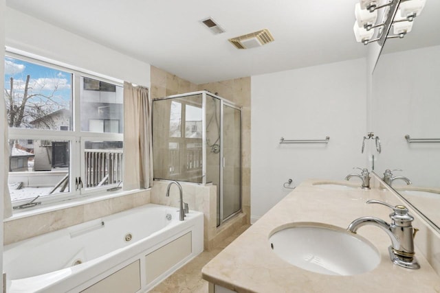 bathroom featuring vanity and separate shower and tub