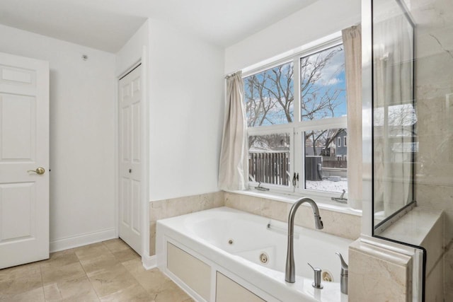 bathroom with a tub to relax in