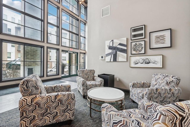 living room with a high ceiling