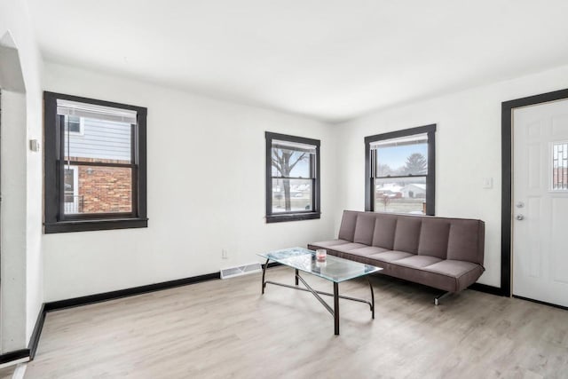 living room with light hardwood / wood-style floors