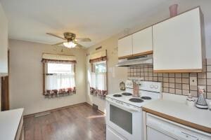 kitchen featuring white cabinetry, dark wood-type flooring, ceiling fan, and white range with electric stovetop