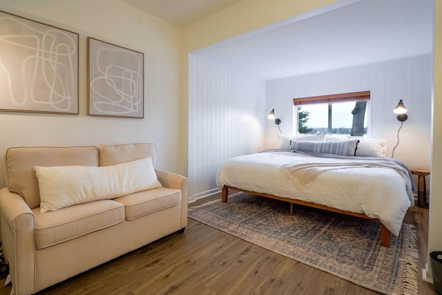 bedroom with hardwood / wood-style flooring