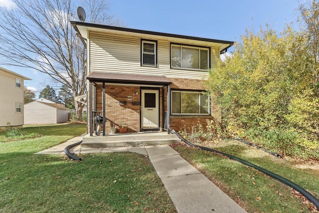 view of property featuring a front lawn