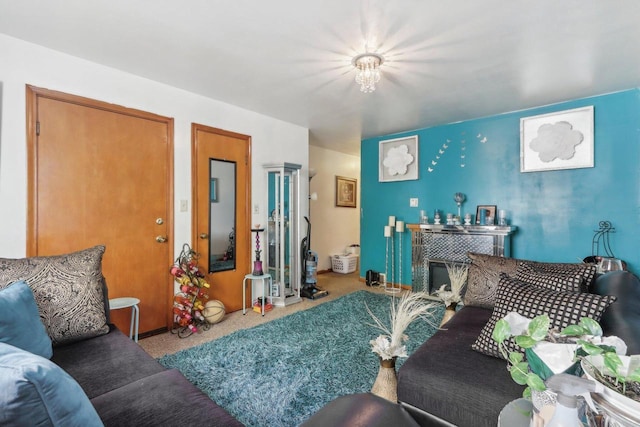 carpeted living room featuring a fireplace