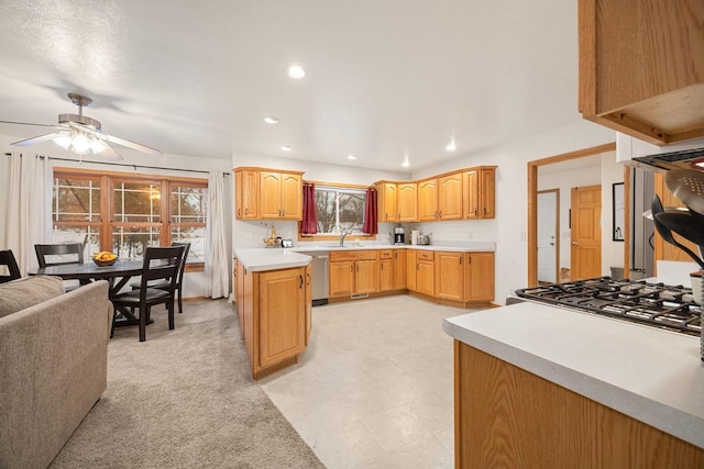 kitchen with light carpet, sink, ceiling fan, and appliances with stainless steel finishes