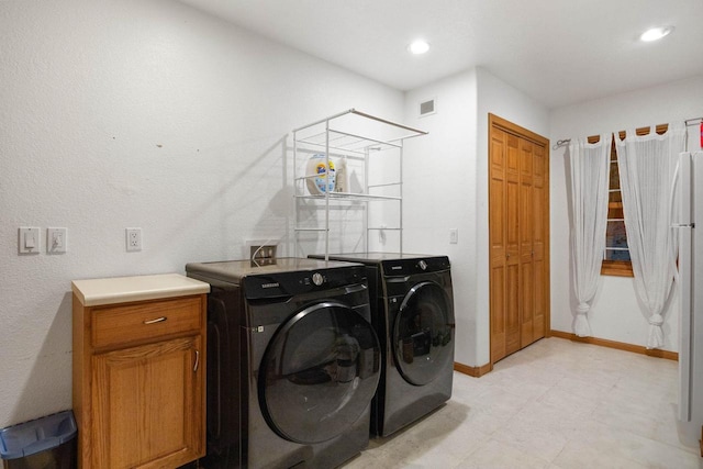 laundry area with independent washer and dryer