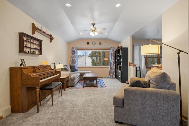 living room featuring lofted ceiling, light carpet, and ceiling fan