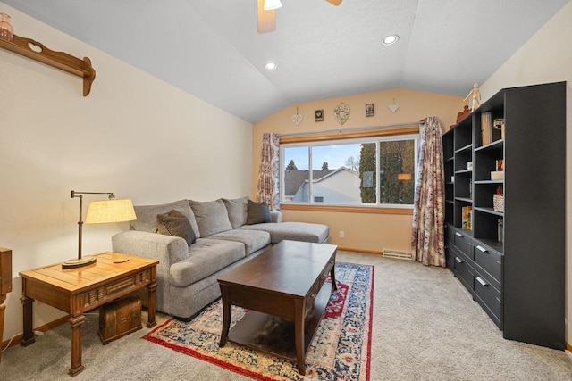 carpeted living room with vaulted ceiling and ceiling fan