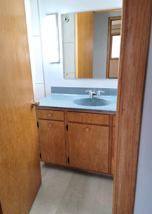 bathroom with vanity and tile patterned floors