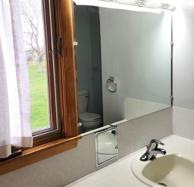 bathroom featuring a sink and toilet