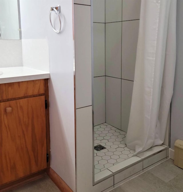 full bath featuring a shower stall and vanity