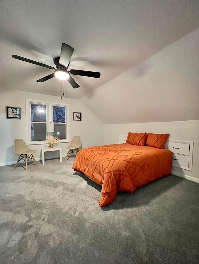 carpeted bedroom featuring lofted ceiling and ceiling fan