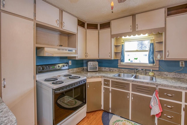 kitchen featuring light hardwood / wood-style floors, sink, a textured ceiling, and white range with electric stovetop