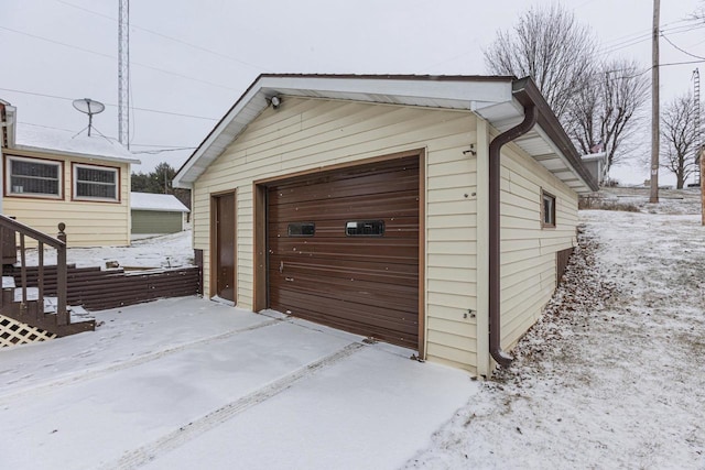 view of snow covered garage