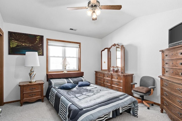 carpeted bedroom featuring lofted ceiling and ceiling fan