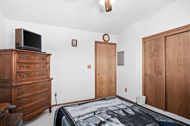 carpeted bedroom featuring a closet and ceiling fan