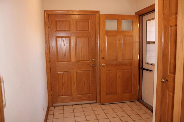 entryway with light tile patterned floors