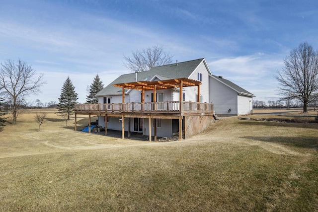 back of property featuring a wooden deck, a yard, and a pergola